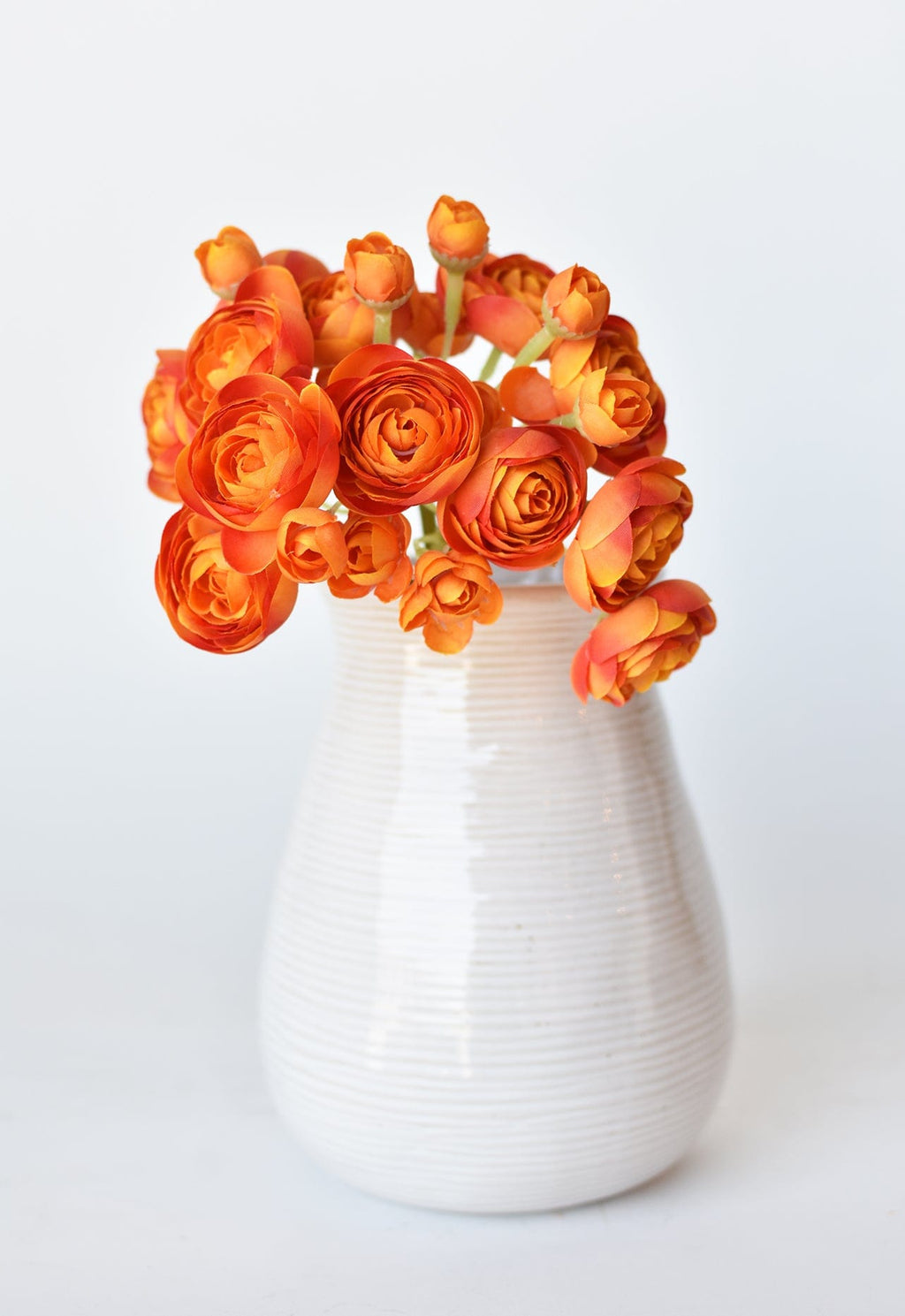 10.5" Faux Peachy Orange Ranunculus Stem Bundle